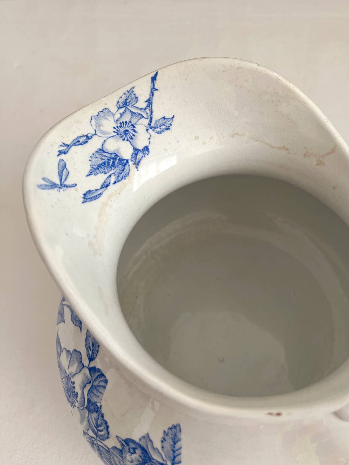 Antique chubby ironstone jug with floral and bird decoration