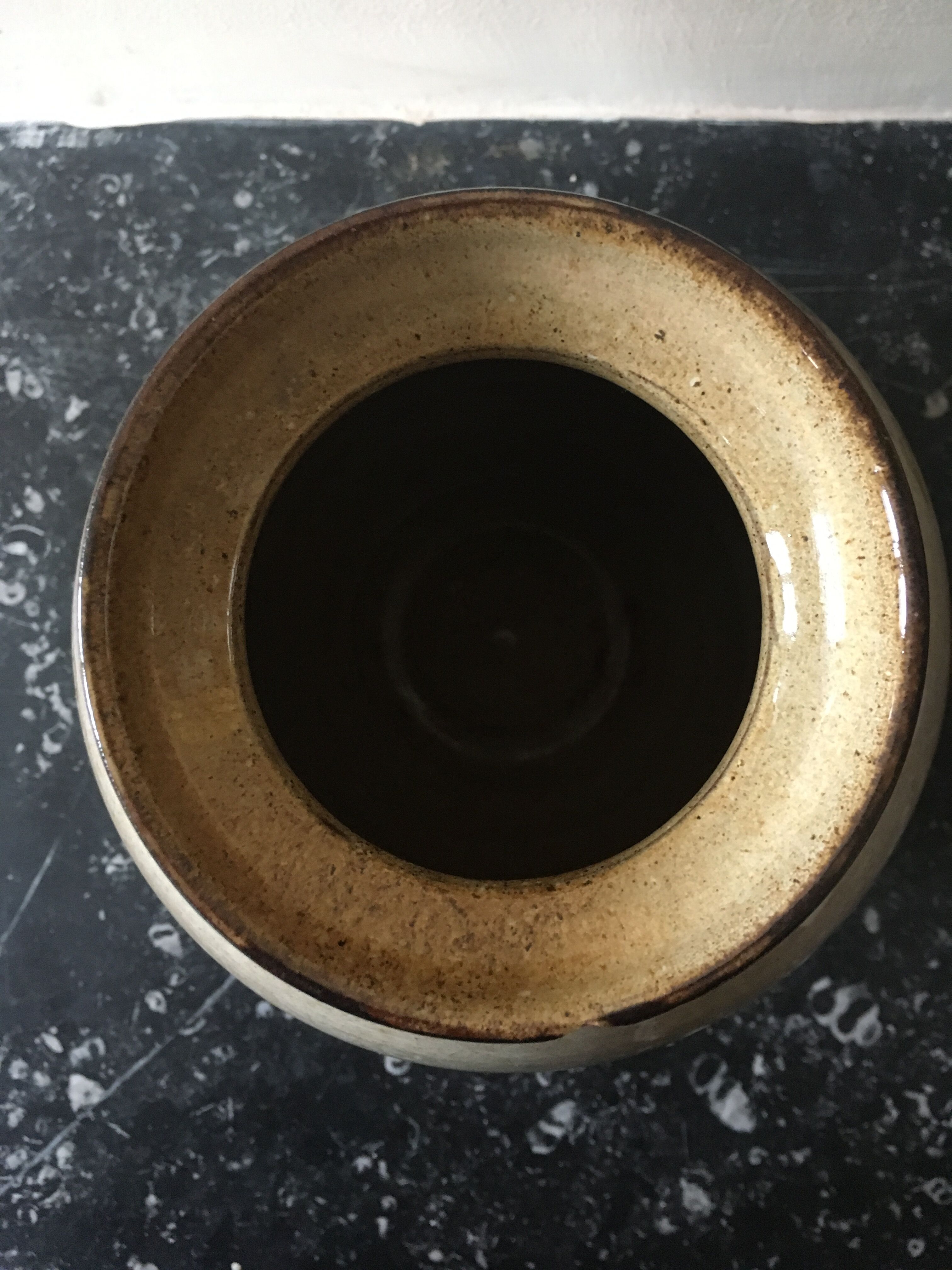 Glazed stoneware ball vase decorated with flowers