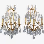 Pair of Louis XVI style gilded bronze & bohemian crystal sconces