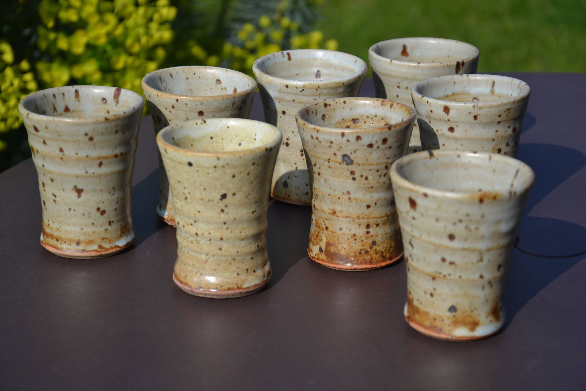 8 stoneware cups/mugs by Gustave Tiffoche
