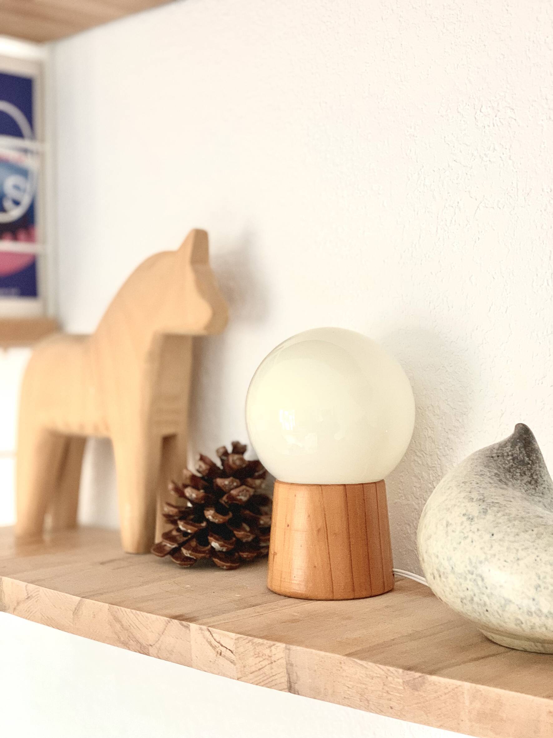 Pair of lamps with wooden base and glass globe, 1970s