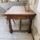 Paneled walnut desk with turned legs, 1900