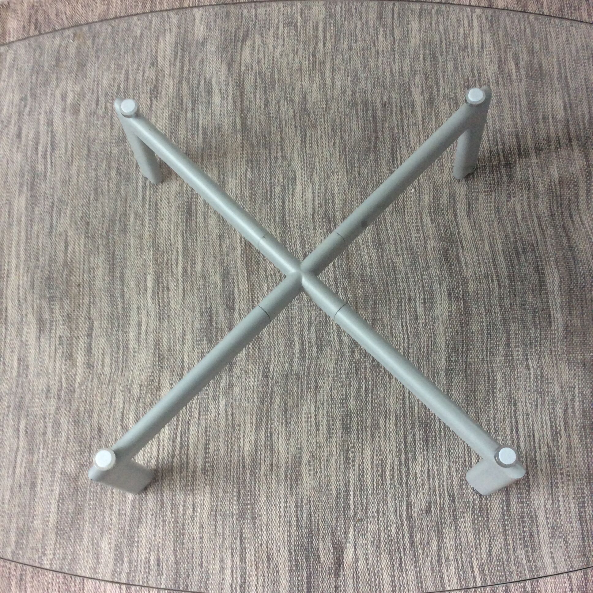 Design coffee table in beveled glass and steel foot