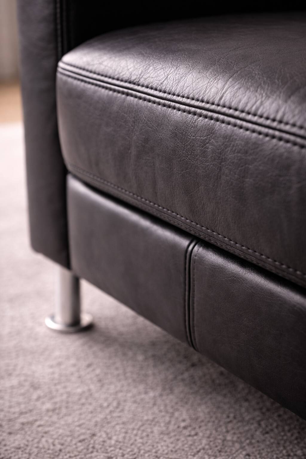 Modern Lounge Armchair with Matching Footstool — Black Leather