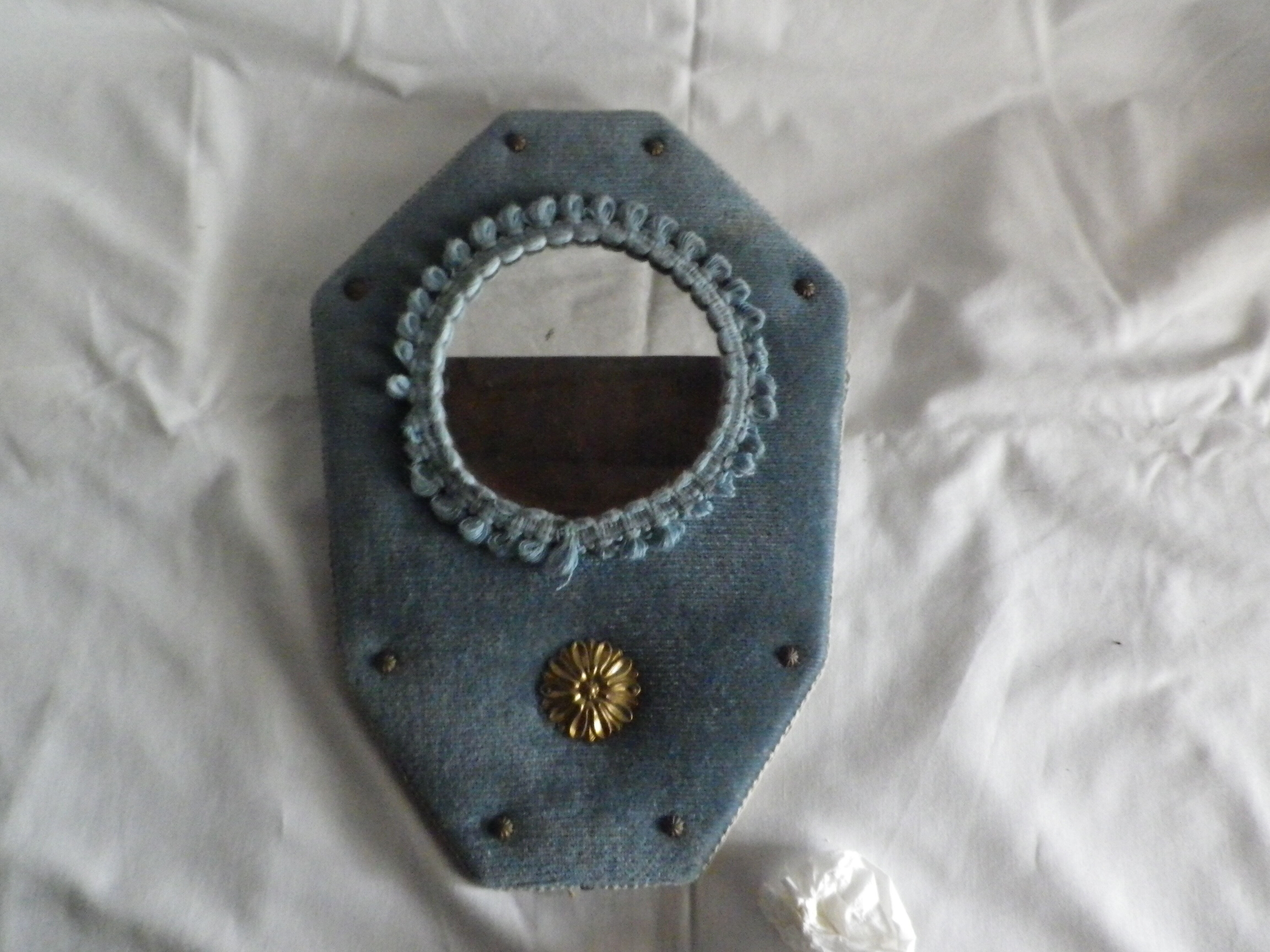 Mirror on blue velvet fabric