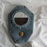 Mirror on blue velvet fabric