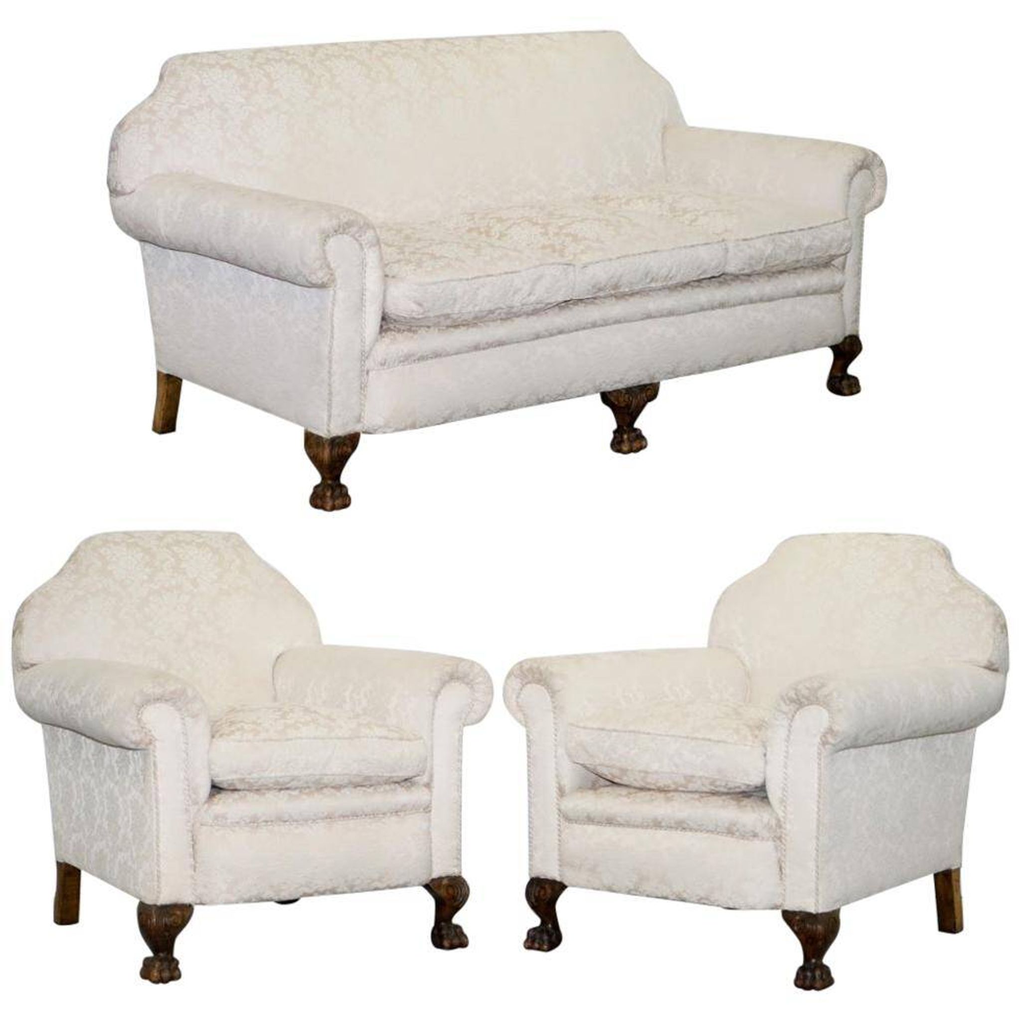 Victorian suite in damask, walnut frame, legs carved in lion's paw.