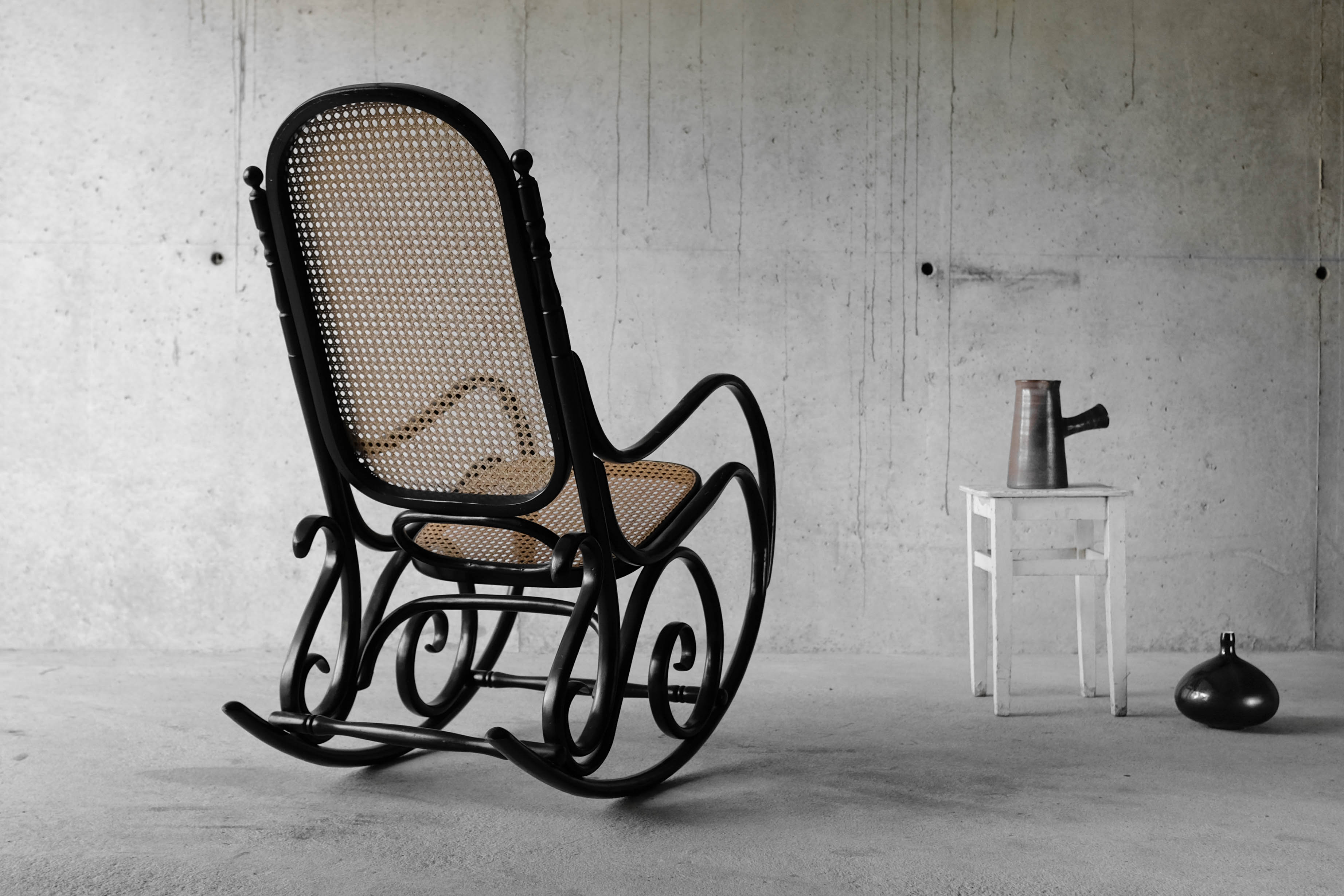Black rocking chair in curved wood, years 50