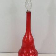 Large designer bottle in red glass