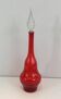 Large designer bottle in red glass