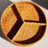 Compartment dish for appetizers, made of porcelain with a wicker support.