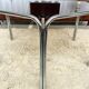 Vintage hexagonal table with smoked glass top and chrome metal structure.