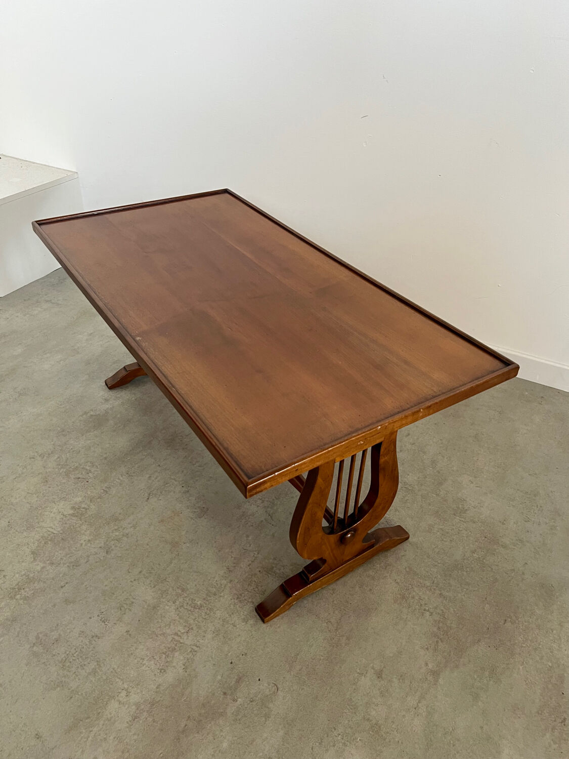 Old rectangular wood coffee table with lyre side posts