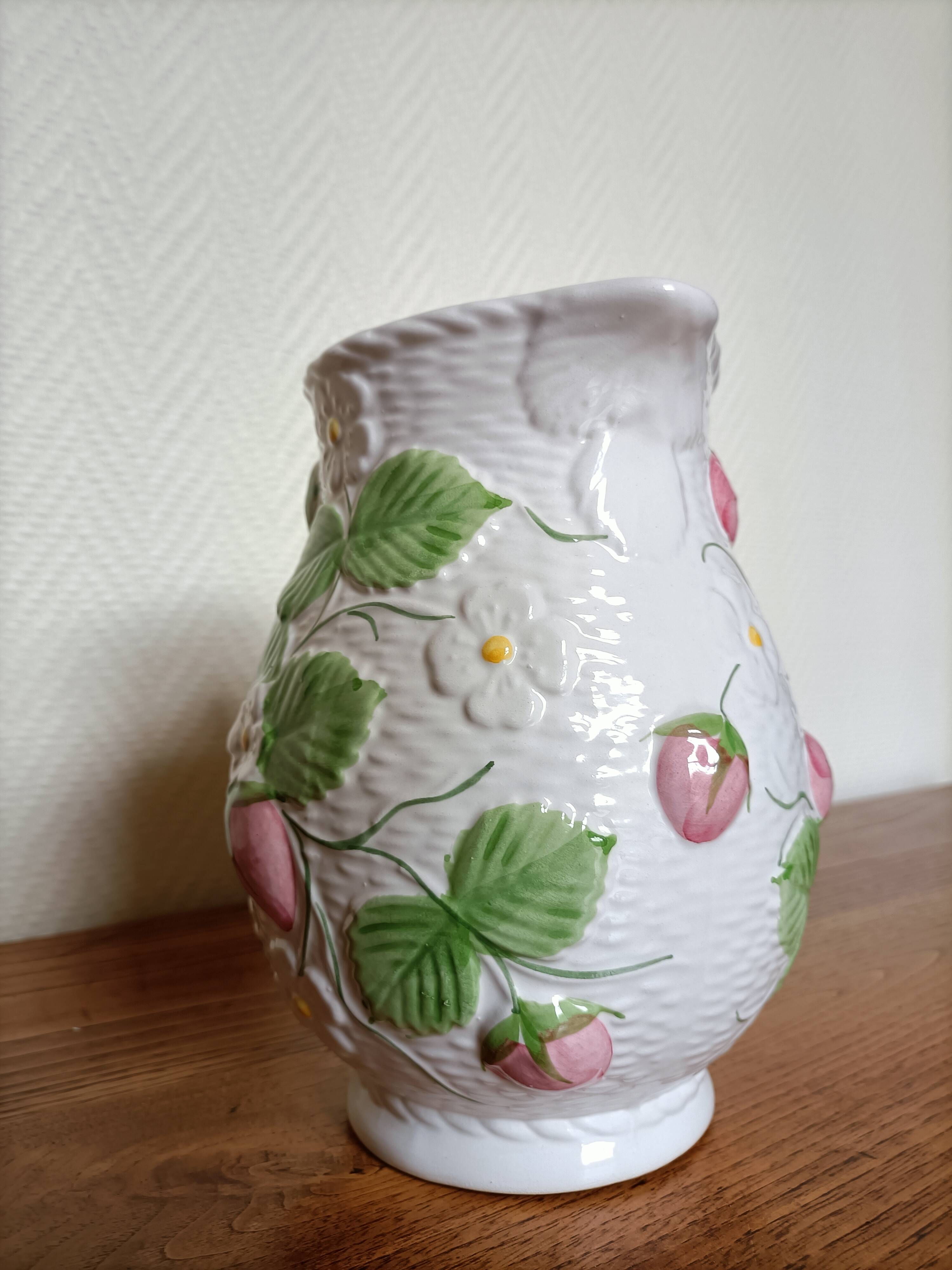 Barbotine pitcher with pastel flower decoration