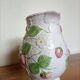 Barbotine pitcher with pastel flower decoration