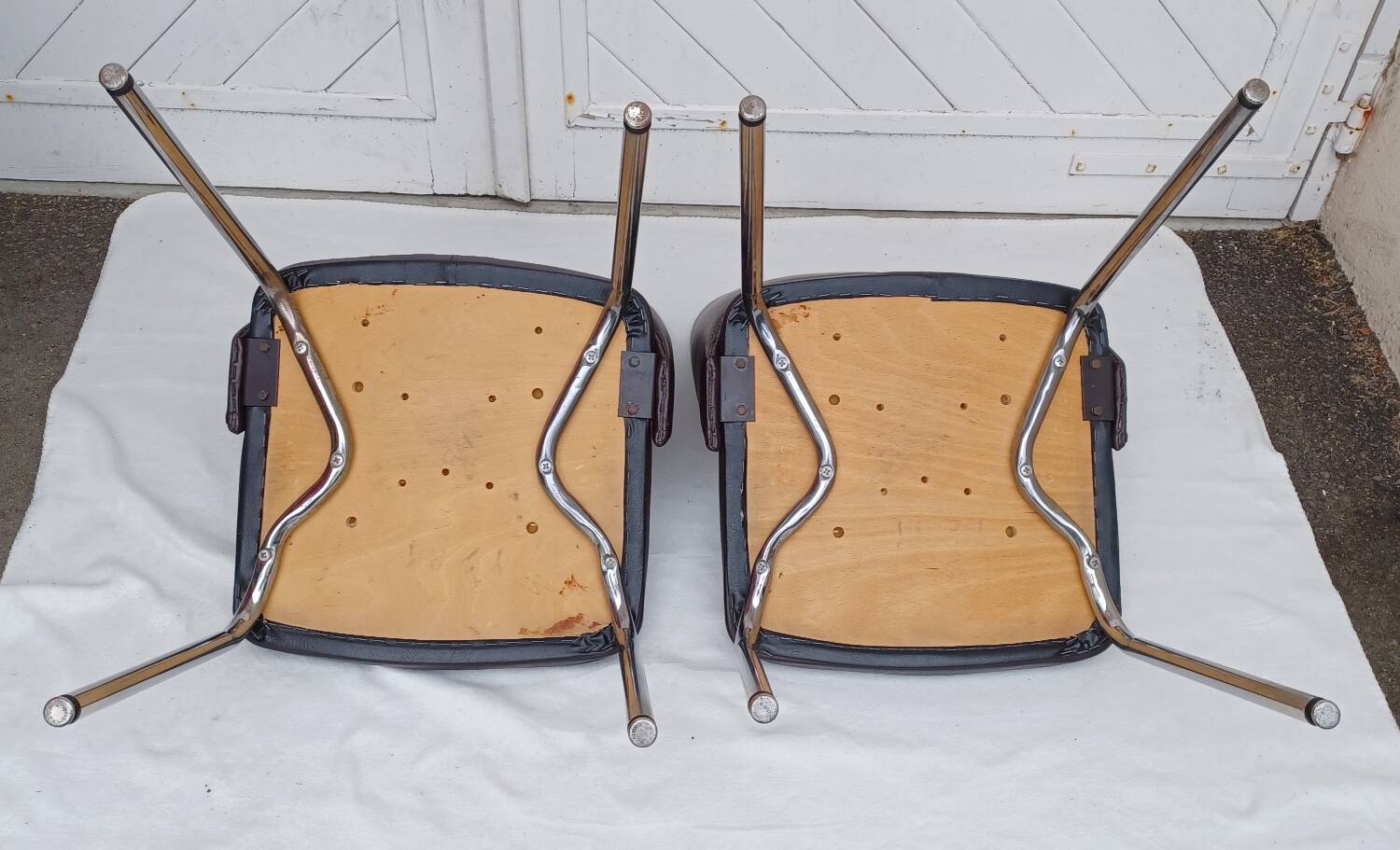 Pair of vintage faux leather and chrome armchairs
