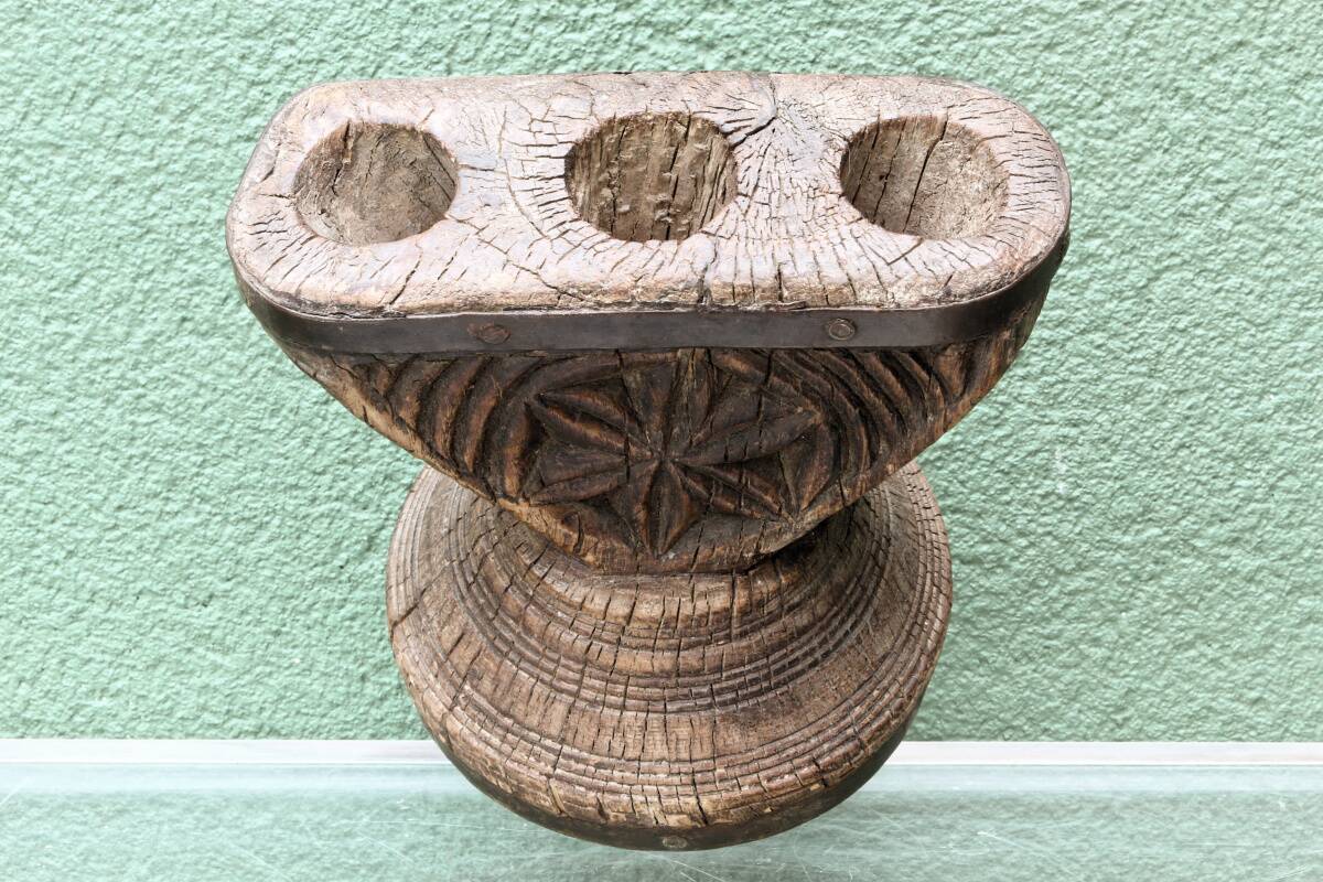 Brutalist candlestick, antique Asian grain sorter in carved wood.
