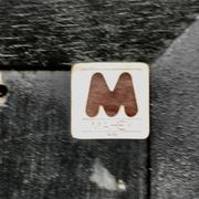 Jean-Claude Mahey mirror. Black lacquered wood and gold metal. 1970