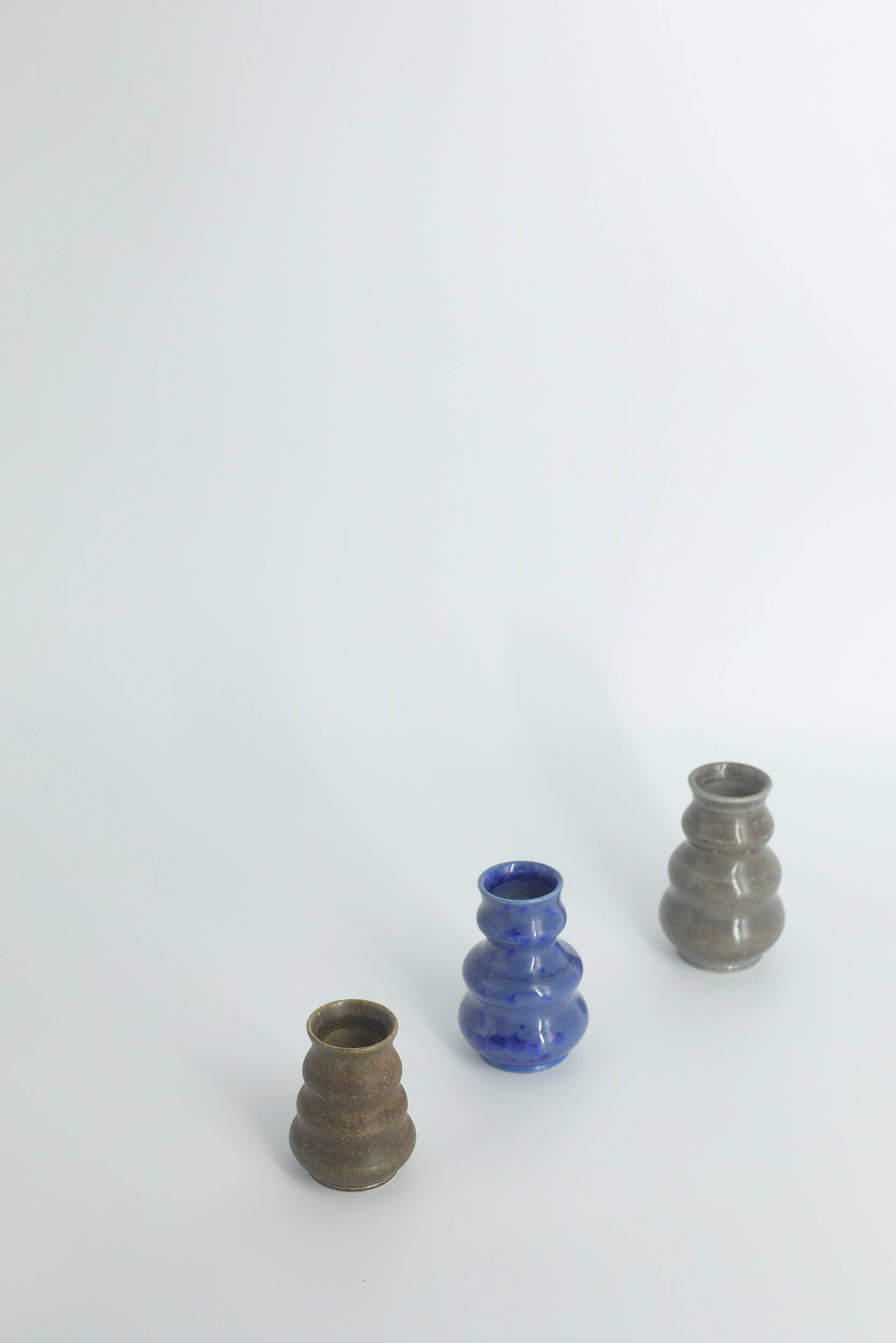 Small collection vases, mid-century modern Scandinavian, in glossy brown and blue stoneware, set of 3.