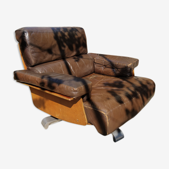 Swivel leather armchair