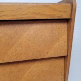 High wooden chest of drawers in the 50s
