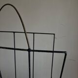 Mid-century poetic magazine rack in black metal