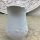 Small white porcelain milk jug