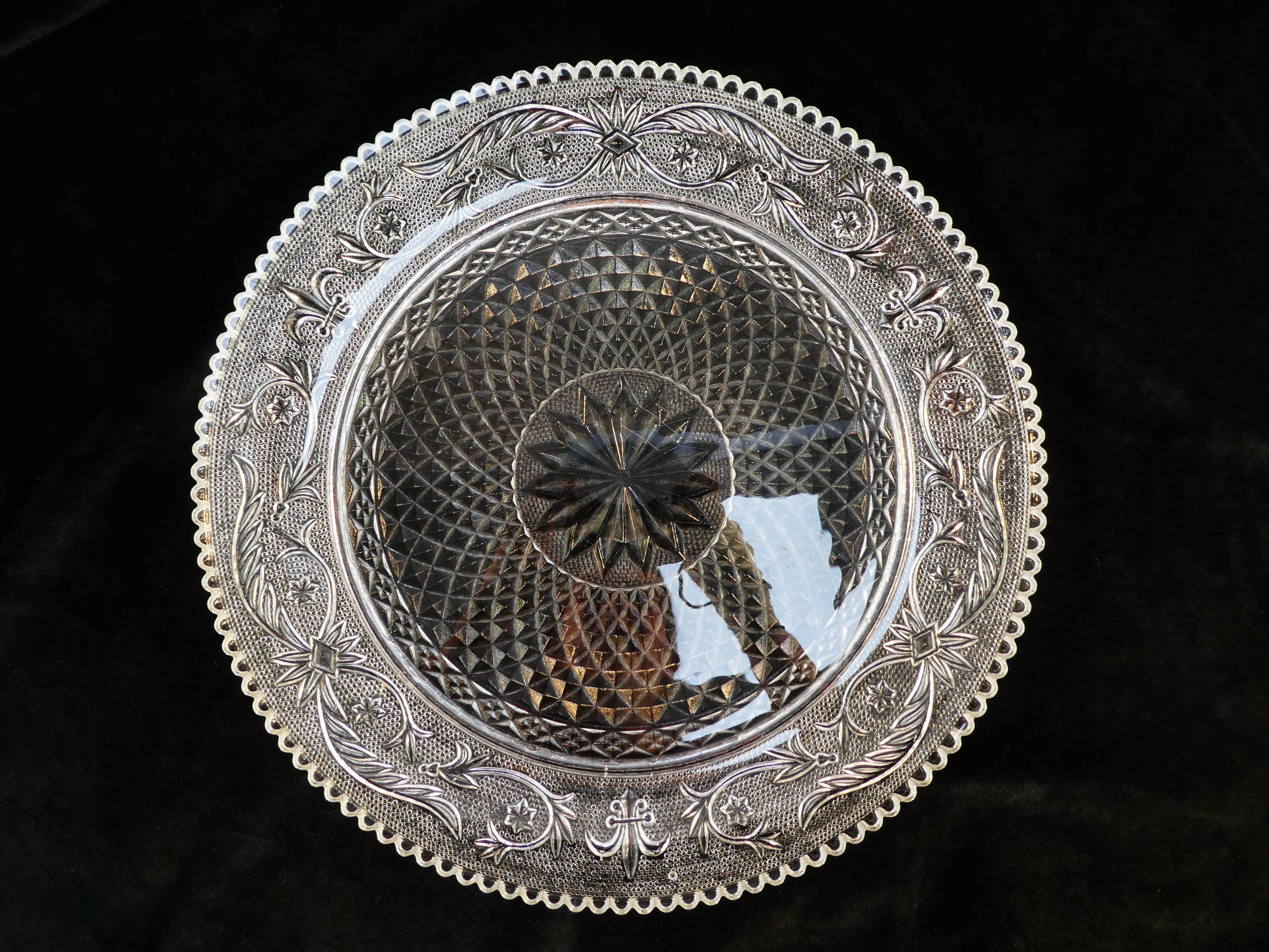 Old plate with pressed glass arabesque pie