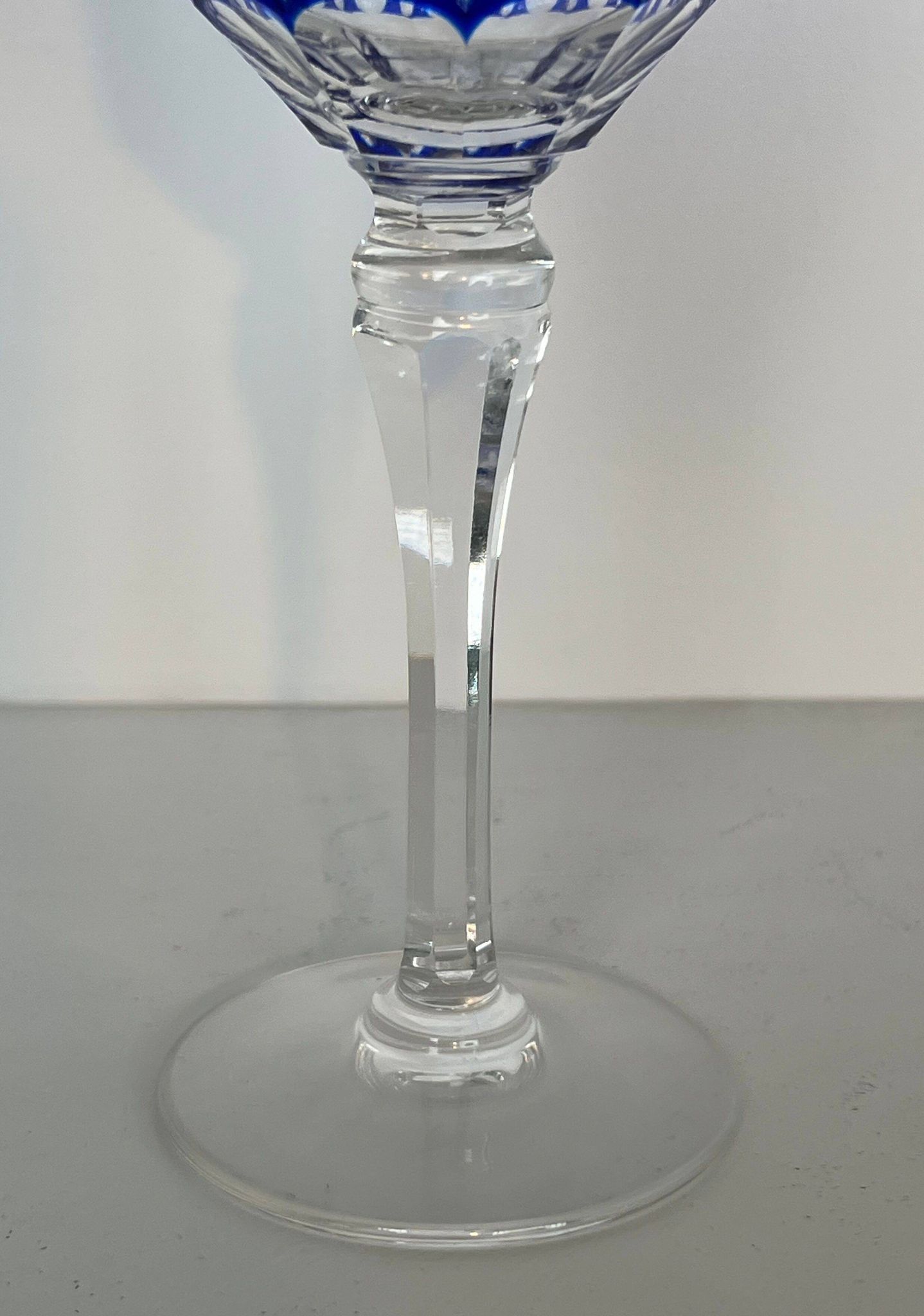 Set of twelve glasses in crystal tinted in different colours and cut with stars.