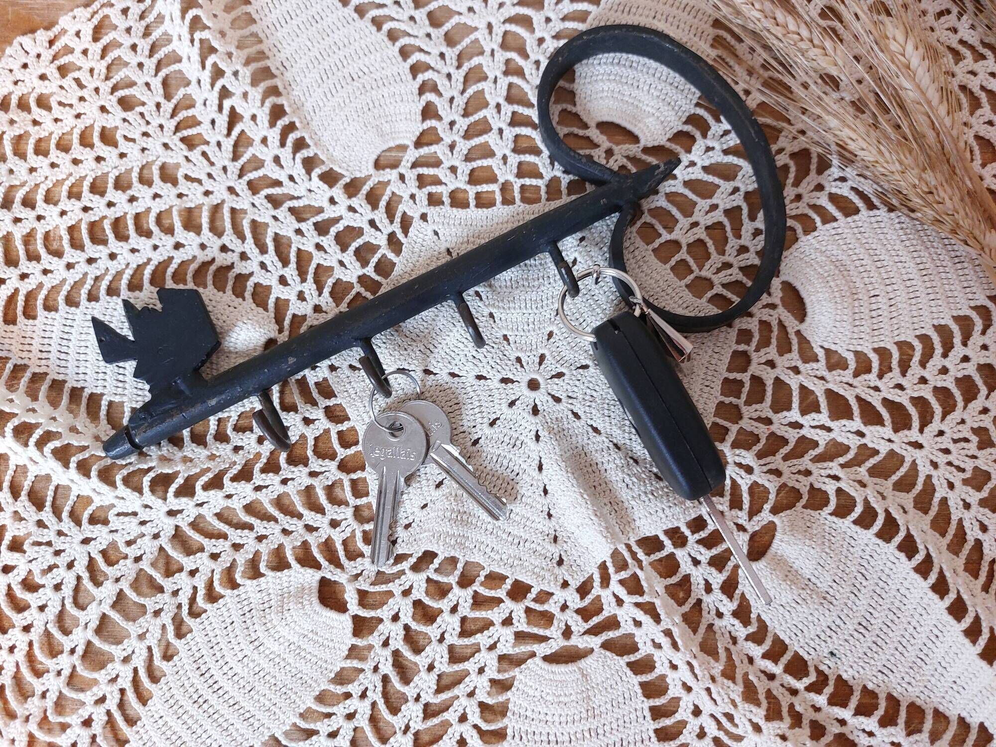 Old wall key holder in the shape of a vintage metal key 4 hooks