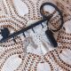 Old wall key holder in the shape of a vintage metal key 4 hooks