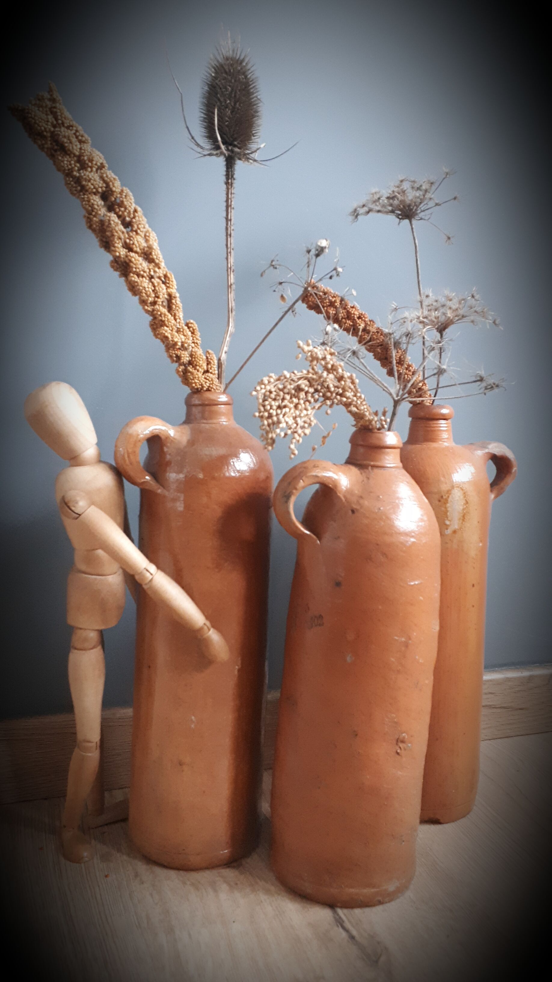 Trio of sandstone bottles