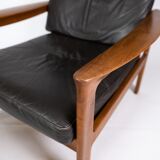 Easy chair with stool in teak upholstered with black leather design Arne Wahl Iversen