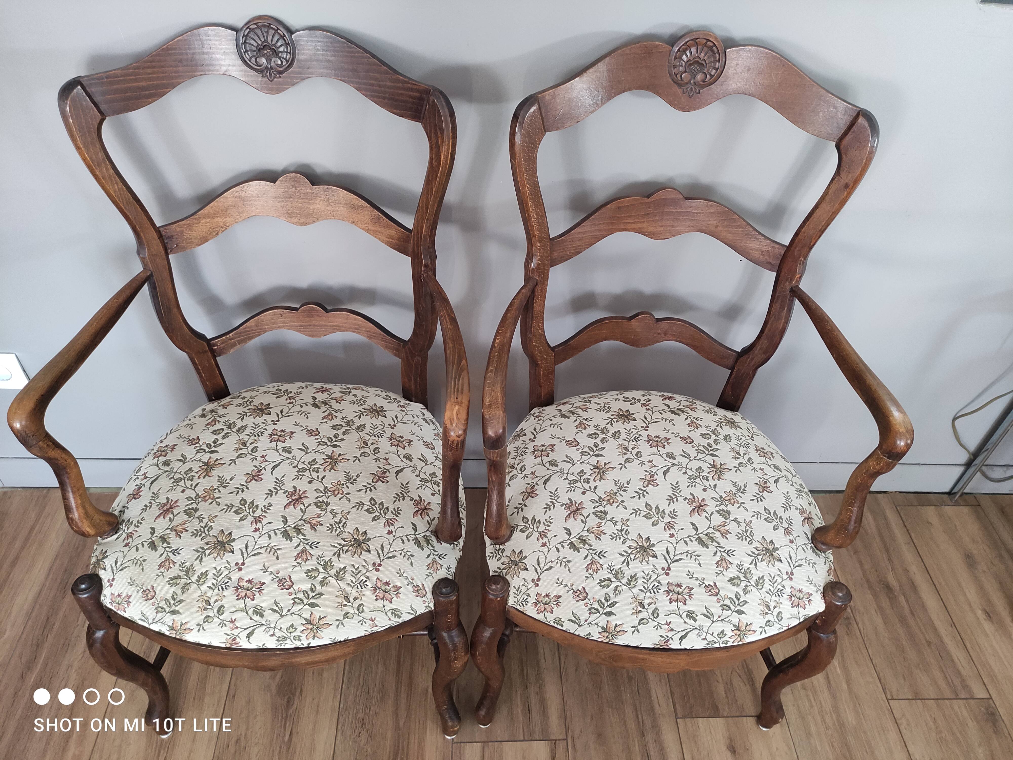 Pair of Provencal armchairs in brown wood and floral fabric