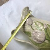 Barbotine pitcher with embossed tulip decoration and spike