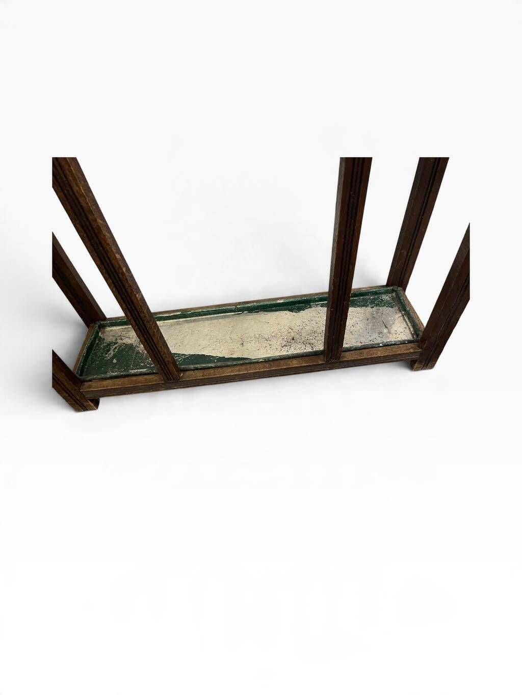 Vintage wooden coat rack with mirror.