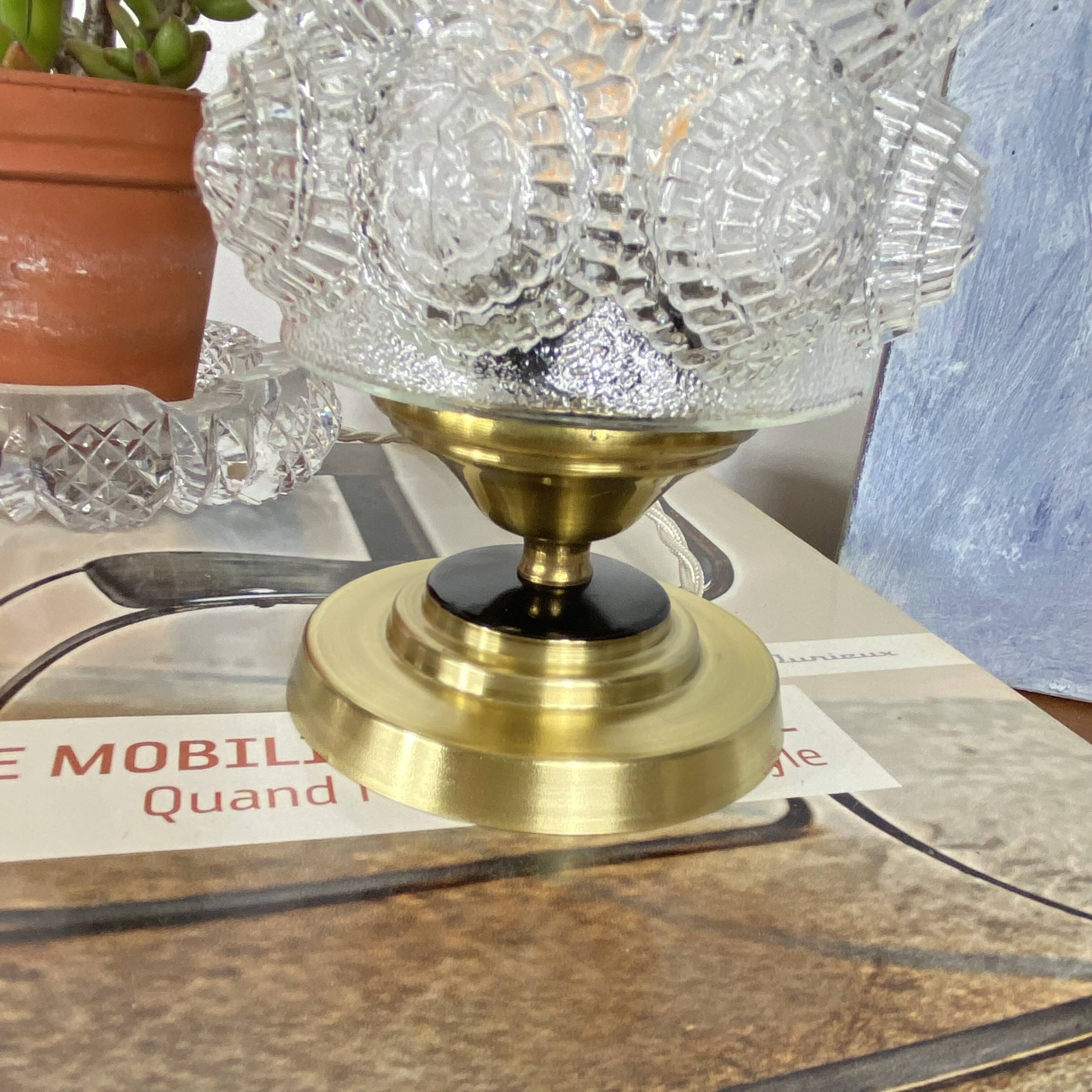 Antique globe table lamp in moulded transparent glass with a brass base.