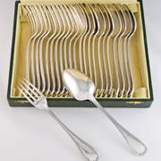 CHRISTOFLE 1907-1935 - 12 table forks and 12 Louis XVI style table spoons, Rubans model