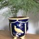 Ancien cache pot en faïence barbotine décor oiseaux - vers 1900