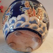 Decorative pot in multicoloured relief glazed ceramic.