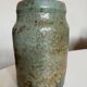 Turquoise and gilded earthenware potter's vase