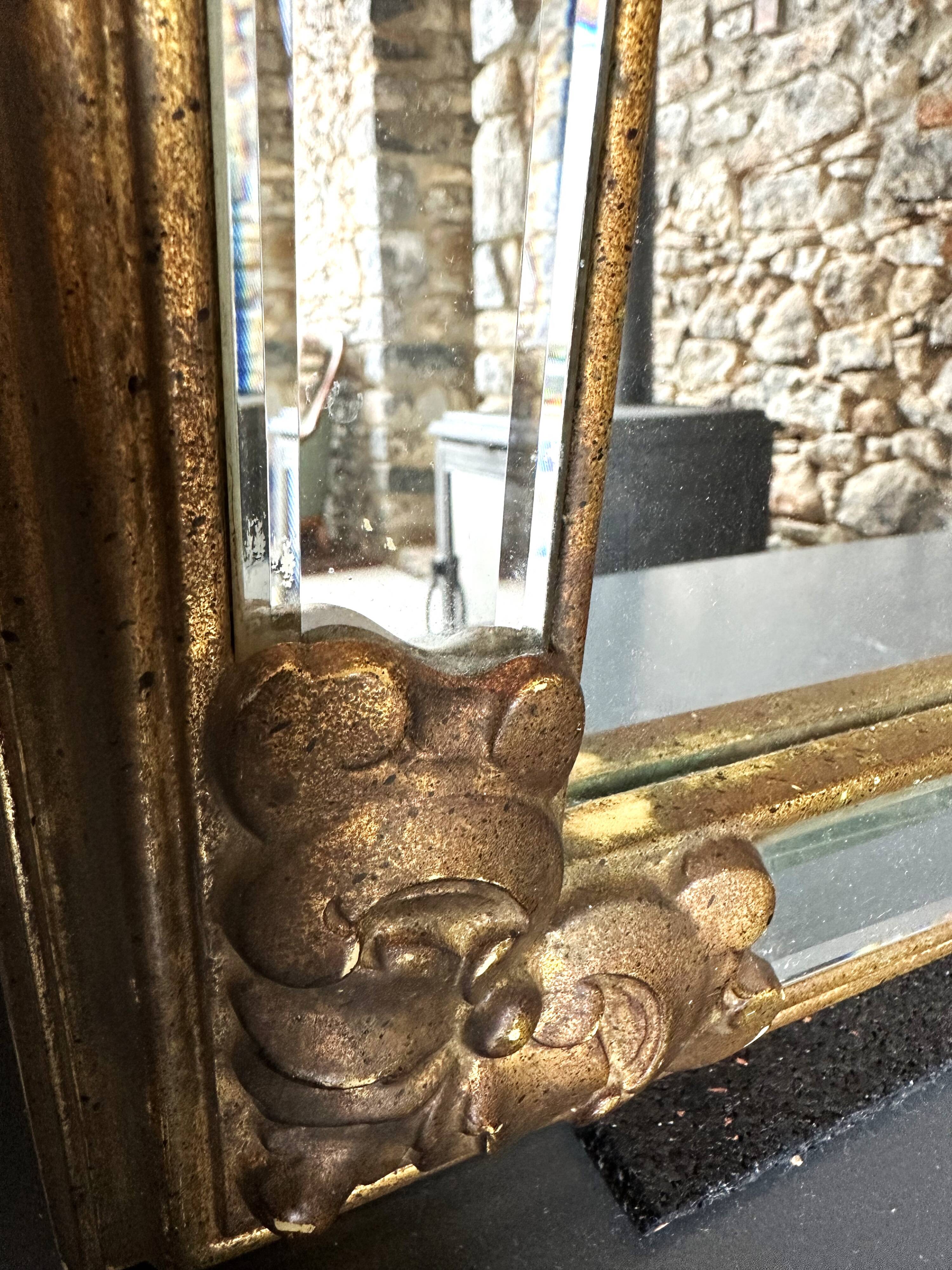 Bevelled gold Deknudt mirror with frames, Belgium, 20th century.