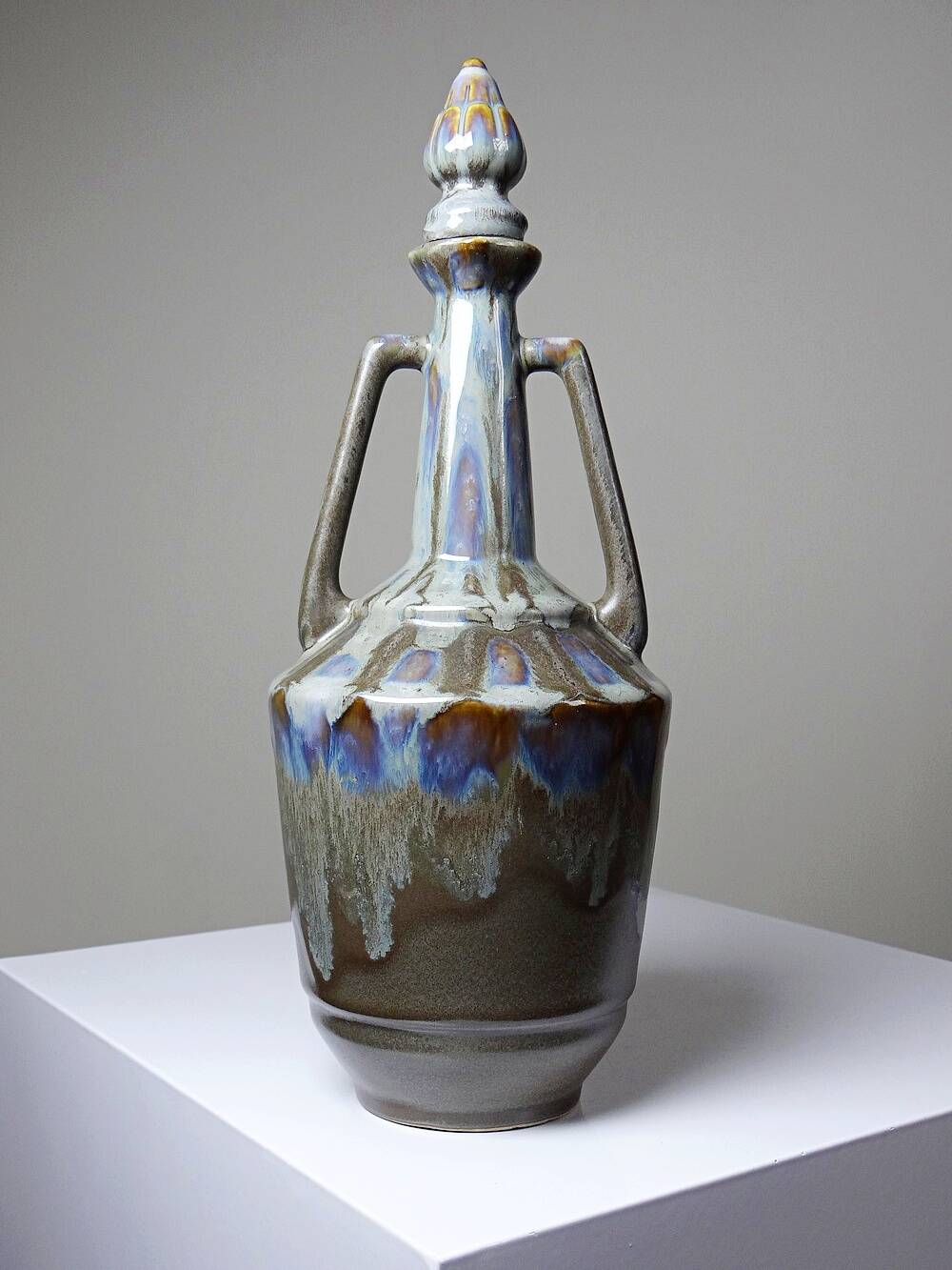 Vintage stoneware bottle with flamed glaze, France 1950-1970.