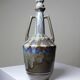 Vintage stoneware bottle with flamed glaze, France 1950-1970.