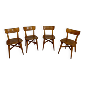 Set of 4 vintage solid oak chairs, 1960s design with sculpted backrest.