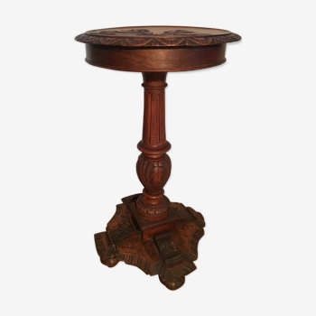 Table wooden pedestal decorated with early 20th century characters