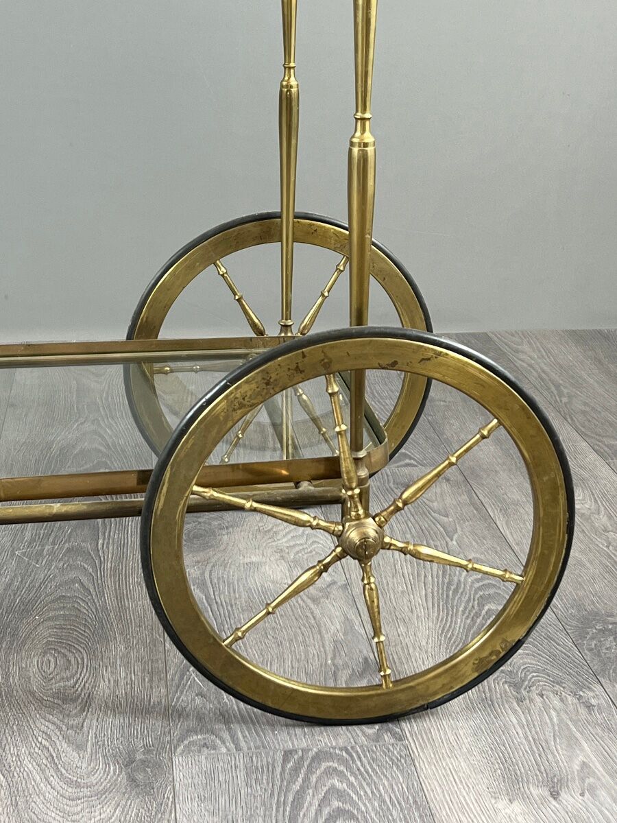 Rolling table cart in gilded brass with two glass shelves, 20th century.