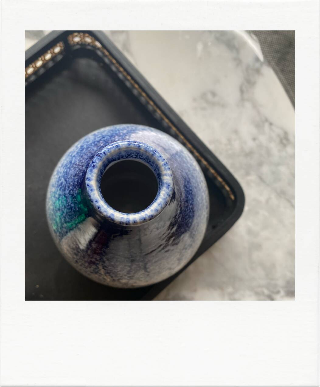 Blue and white speckled vase