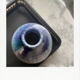 Blue and white speckled vase
