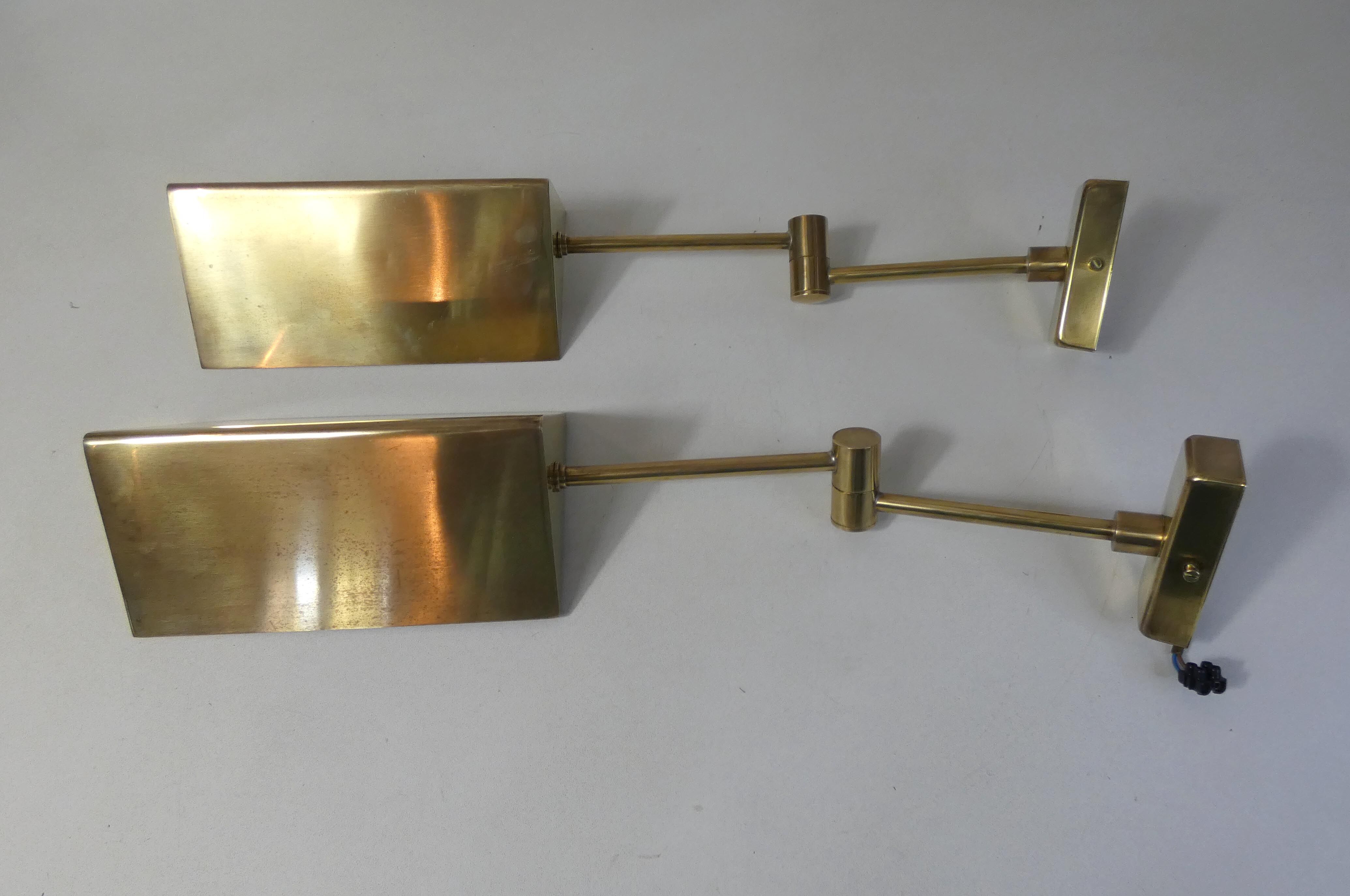 Pair of adjustable brass wall lamps after koch & lowy